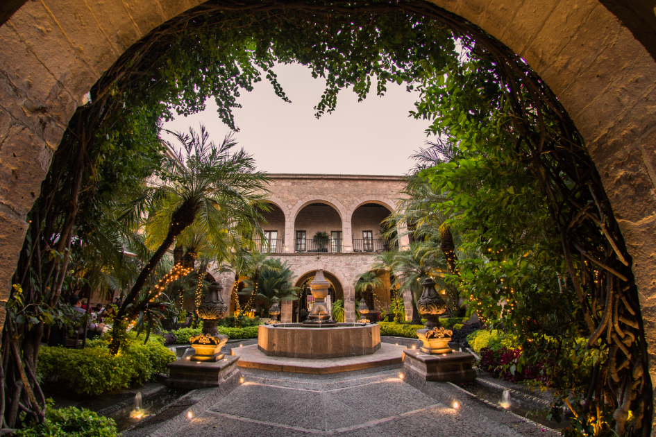 hotel de la soledad patio featuring the building's original architecture around a modern water fountain