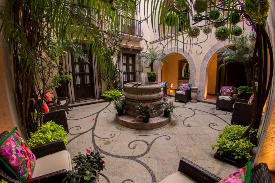 hotel de la soledad patio featuring original architecture and water fountain combined with modern furniture
