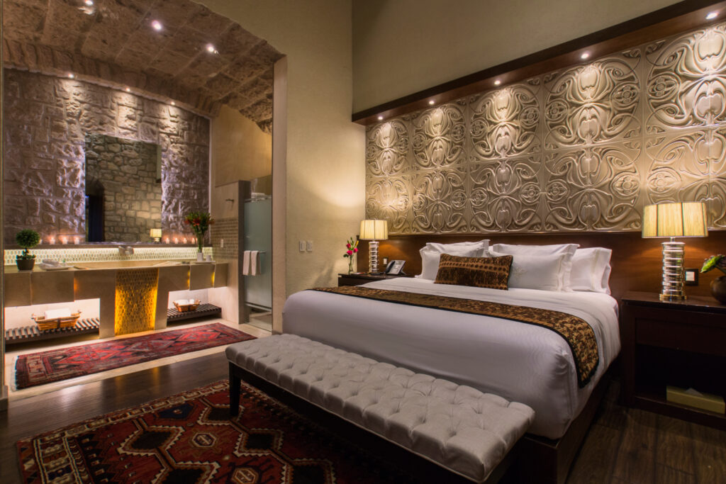 hotel de la soledad guest room featuring original architecture mixed with modern mexican artwork and furniture